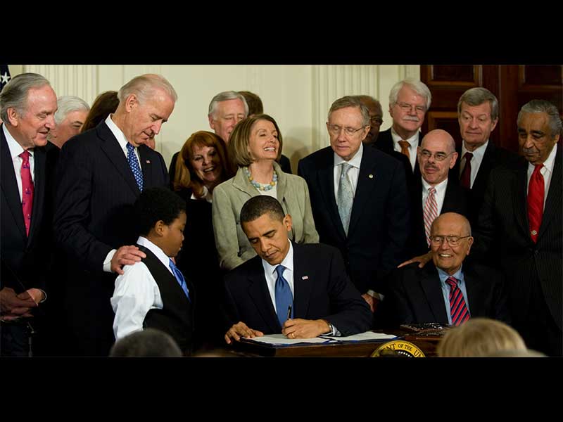 President Obama signing.