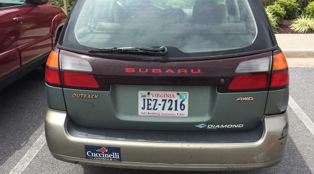 Bumper sticker on Subaru.